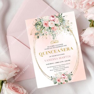 May include: A blush pink Quinceañera invitation with a floral design and gold accents. The invitation features the text "Quinceañera" in gold script, along with event details. A matching pink envelope is included.