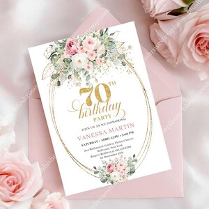 May include: A white invitation card for a 70th birthday party, featuring gold text and a floral design. The card includes the text "70th birthday party" and event details. The card is placed inside a pink envelope, with pink roses in the background.