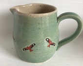 Hand thrown jug decorated with red kite birds.  A bespoke item.