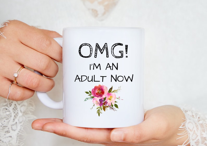 Woman holding OMG im an adult coffee tea mug cup