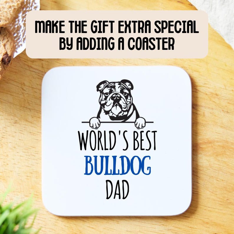 May include: White ceramic coaster with a black and white illustration of a bulldog peeking over the top. The text "World's Best Bulldog Dad" is printed in black with the word "Bulldog" in blue.