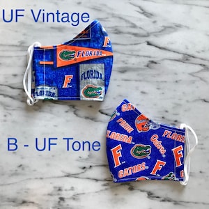 UF Gator Sports Face Masks. Washable, double layer w/thin filter and an opening pocket for additional filters. Adult one size.