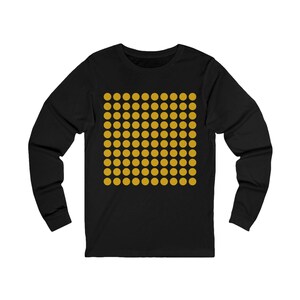 May include: Black long-sleeve shirt with a pattern of gold circles.