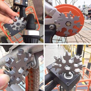 Op de afbeelding: Een multitool in de vorm van een sneeuwvlok met verschillende maten inbussleutels, schroevendraaiers en andere gereedschappen. De tool is bevestigd aan een fiets.