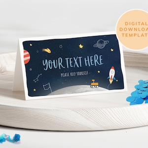 May include: A blue and black printable space-themed table card with a rocket, stars, a planet, and the text "Your Text Here" and "Please Help Yourself".