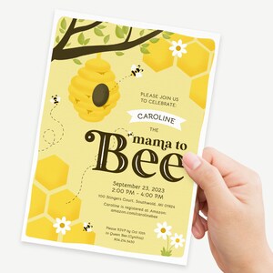 May include: A yellow and brown baby shower invitation with a beehive and bees. The text reads "Please join us to celebrate: Caroline the mama to Bee. September 23, 2023, 2:00 PM - 4:00 PM, 100 Stingers Court, Southwold, MI 01924. Caroline is registered at Amazon: amazon.com/carolinebee. Please RSVP by Oct 10th to Queen Bee (Cynthia) 904.214.5430."