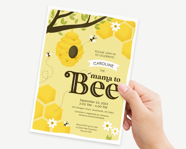 May include: A yellow and brown baby shower invitation with a beehive and bees. The text reads "Please join us to celebrate: Caroline the mama to Bee. September 23, 2023, 2:00 PM - 4:00 PM, 100 Stingers Court, Southwold, MI 01924. Caroline is registered at Amazon: amazon.com/carolinebee. Please RSVP by Oct 10th to Queen Bee (Cynthia) 904.214.5430."