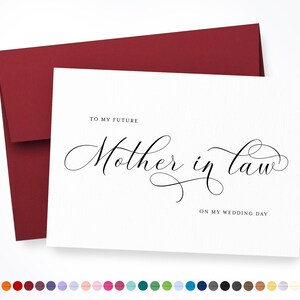 May include: A white card with a red envelope. The card has the text "To my future Mother in law" written in cursive script. The text "On my wedding day" is written in smaller font below the cursive text.
