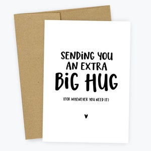 May include: White card with black text that reads "Sending you an extra big hug (for whenever you need it)".
