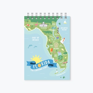 May include: A colorful illustrated map of Florida with the text "Florida, The Sunshine State" and various landmarks and icons, including a lighthouse, a beach umbrella, a palm tree, a Ferris wheel, and a car.