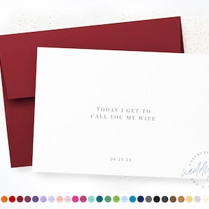 May include: A white card with the text "TODAY I GET TO CALL YOU MY WIFE" and the date "04.15.23". The card is in a red envelope.