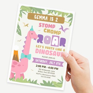 May include: A pink dinosaur with a blue bow tie and a party hat. The text on the invitation reads "Gemma is 2 Stomp Chomp Roar Let's Party Like a Dinosaur. Please Join Us: Saturday, July 8th 2:00 PM - 4:00 PM 100 Wildwoods Lane Willow End, OR 21039 RSVP to Mamasaurus (Mel: 555.123.4598".