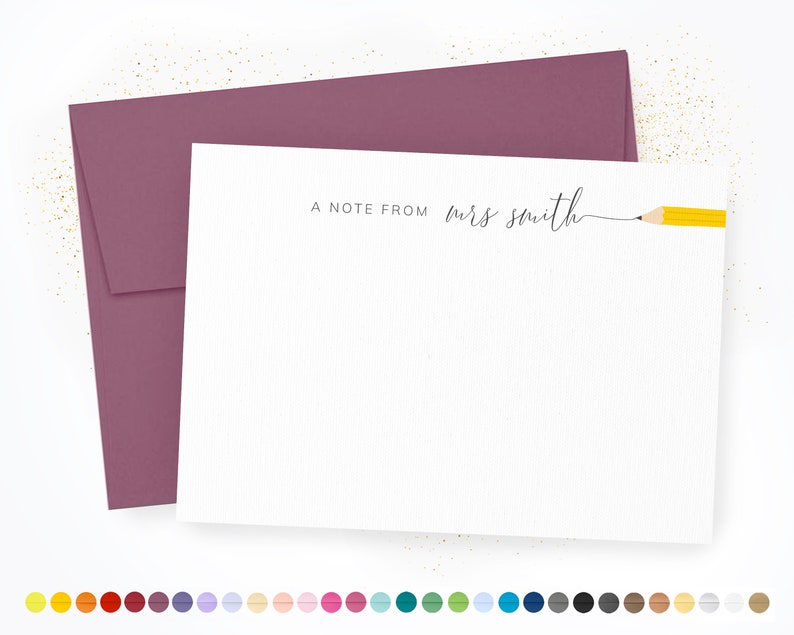May include: A white note card with a pink envelope. The note card has the text "A Note From Mrs. Smith" with a yellow pencil drawn on the right side.