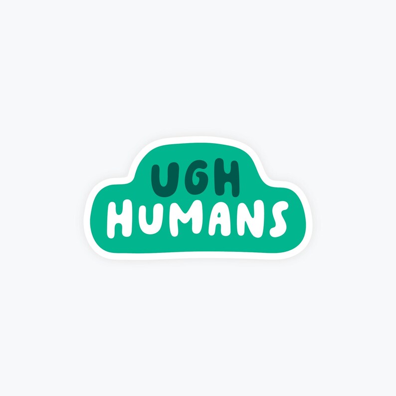 May include: A sticker with a green cloud shape and the words "UGH HUMANS" in white and dark green lettering. The sticker has a white border and is set against a white background.