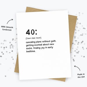 May include: A white greeting card with the number "40:" printed in black, along with a definition. The card is on a brown envelope. The text reads "canceling plans without guilt, getting excited about new socks, finding joy in early bedtime."