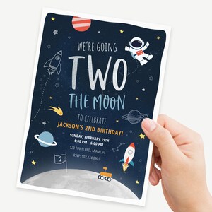 May include: A blue and white space-themed birthday invitation with the text "We're going two the moon to celebrate Jackson's 2nd birthday!"  The invitation features a rocket, an astronaut, planets, and stars.