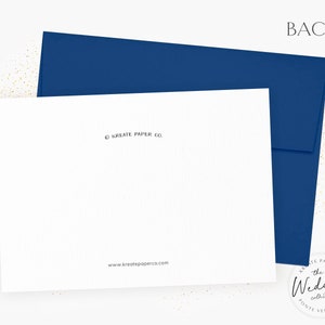 May include: A white card with a navy blue envelope. The card has the text "BACK", "&copy; KREATE PAPER CO." and "www.kreatepaperco.com". The Wedding Collection logo is in the bottom right corner.
