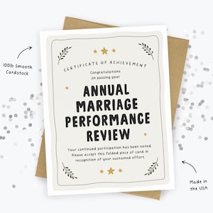 May include: A cream-colored greeting card featuring the text Certificate of Achievement, Congratulations on passing your Annual Marriage Performance Review, Your continued participation has been noted. Please accept this folded piece of card in recognition of your sustained effort. The card is printed on 100lb smooth cardstock and made in the USA.