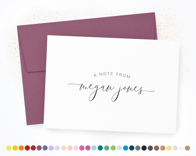 May include: A white card with a mauve envelope. The card has the text "A note from Megan Jones" in black script.