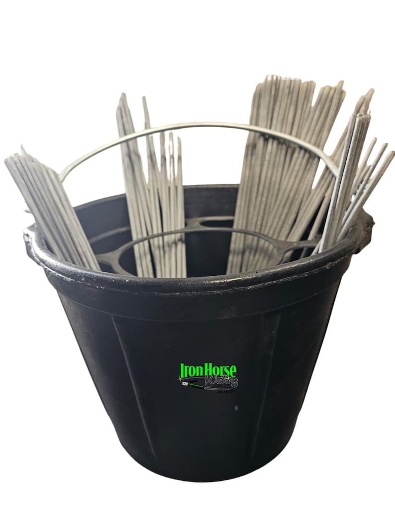 May include: A black bucket filled with gray welding rods. The bucket has a metal handle and the words "Iron Horse Welding" in green and white on the side. The rods are arranged in bundles.