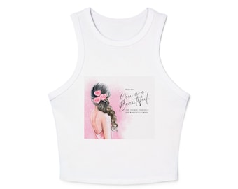 May include: A white sleeveless crop top featuring a watercolor illustration of a person with long brown hair adorned with pink flowers. The text reads: Psalm 139:14 You are Beautiful. For you are fearfully and wonderfully made.