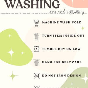 May include: A cream-colored graphic with washing instructions. Text includes "WASHING" and "care and instructions." Symbols indicate machine wash cold, turn item inside out, tumble dry on low, hang for best care, and do not iron design.