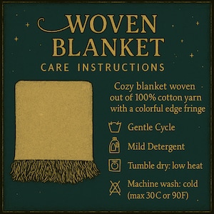 May include: A woven blanket care instruction card. The card features the words "WOVEN BLANKET" and "CARE INSTRUCTIONS" in gold lettering. The card also includes a drawing of a beige blanket with a fringe and washing instructions.