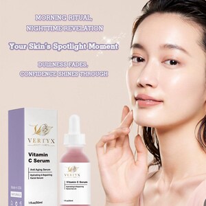 May include: A clear glass bottle with a dropper filled with a pink liquid. The bottle is labeled "VERTYX Vitamin C Serum" and "Anti Aging Serum". The bottle is 1 fl oz / 30 ml. The bottle is sitting on a white surface.