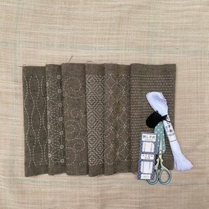 Taupe sashiko hand embroidery kit of two pre-printed fabrics with traditional Japanese wash-away pattern sampler, Japan traditional patterns