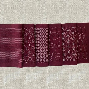 Red sashiko hand embroidery kit of two pre-printed fabrics with traditional Japanese wash-away pattern sampler, Sashiko sewing beginners