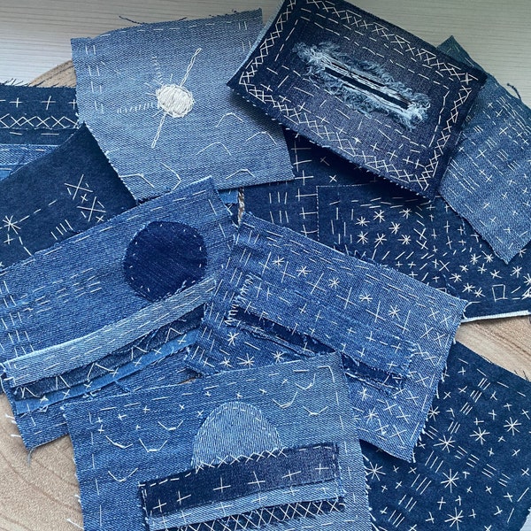 Patches of different sizes of denim hand sewn with the Japanese sashiko technique, Boro collage patch made of indigo blue fabric, Boro patch