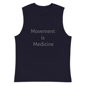 May include: Navy blue sleeveless shirt with the text "Movement is Medicine" printed in gray.