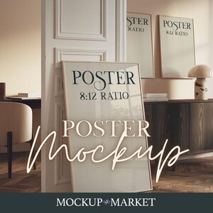 May include: A poster mockup with three frames, two smaller frames on the top and one large frame on the bottom. The frames are all white with a thin black border. The text on the frames reads "Poster 8:12 Ratio". The frames are leaning against a wooden cabinet with a light brown surface. The cabinet is in a room with a light brown wooden floor.