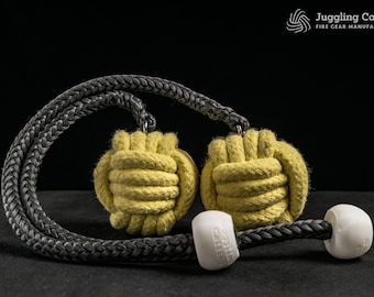 May include: Two yellow fire poi with black rope handles. The poi are made of tightly woven rope and have a knot at the end. The handles are made of black rope and have a white plastic end cap.
