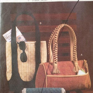 May include: Three woven handbags in different colors and styles. The top bag is brown with a braided strap and tassels. The middle bag is beige with a black strap. The bottom bag is blue with a beige trim.