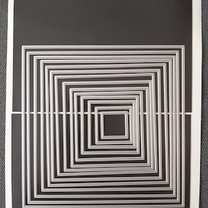 May include: A sheet of paper with a black background featuring a set of nested square dies. The dies are silver and arranged in a series of progressively smaller squares. The text "Momenta Large Nested Square Dies (14 Dies)" is written at the top.