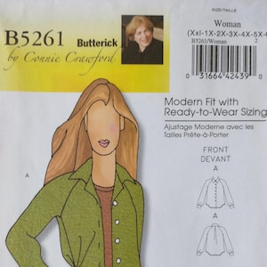 May include: A Butterick sewing pattern, B5261 by Connie Crawford, features a woman's jacket design. The pattern includes sizes XXL to 6X and has the text "Modern Fit with Ready-to-Wear Sizing". The illustration shows a green jacket over a brown shirt.