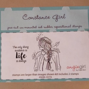 May include: A package of pre-cut, unmounted red rubber repositional stamps. The package features the text "Constance Girl" and a line drawing of a woman with a braid. The text "The only thing constant in life is change" is also included.