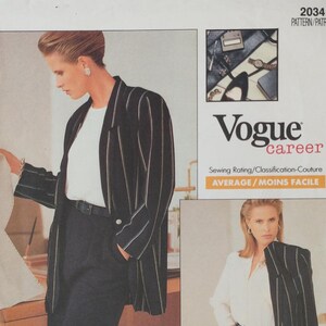 May include: A vintage Vogue Career sewing pattern, number 2034, featuring a woman wearing a black and white striped blazer, white top, and black pants. The pattern includes the text "AVERAGE/MOINS FACILE".