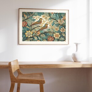 May include: A framed print of a vintage botanical illustration featuring two birds perched on branches with intricate floral details in shades of green, yellow, and orange.