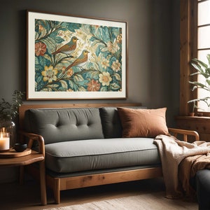 May include: A framed print of a vintage botanical illustration featuring two blue birds perched on leafy branches with yellow and white flowers. The print is in a dark wood frame and hangs on a gray wall.