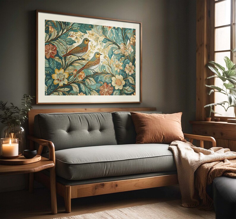 May include: A framed print of a vintage botanical illustration featuring two blue birds perched on leafy branches with yellow and white flowers. The print is in a dark wood frame and hangs on a gray wall.
