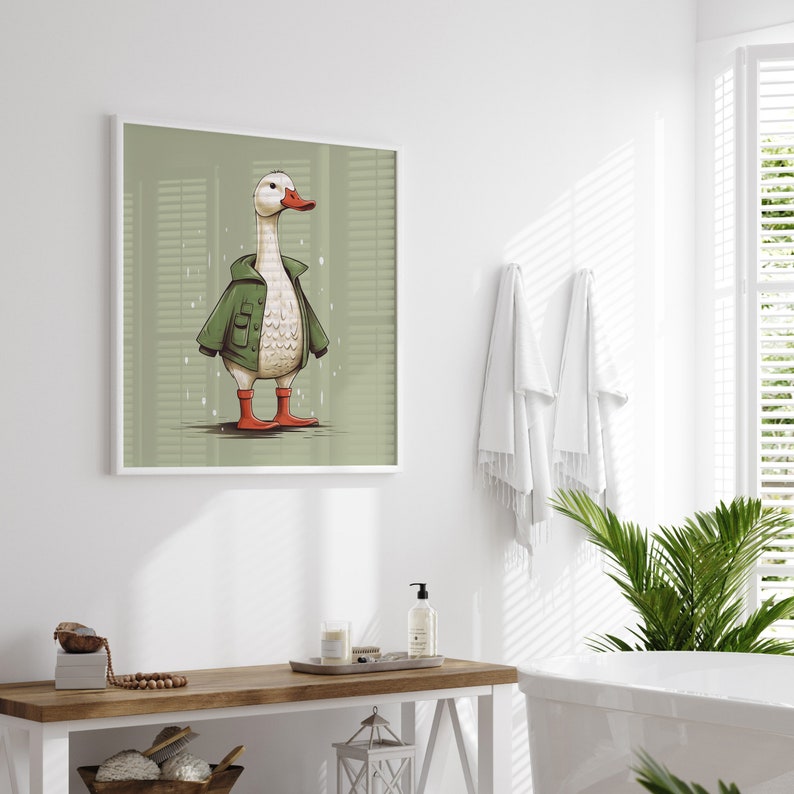 May include: A white duck wearing a green jacket and red boots stands on a green background. The duck is looking to the right. The image is framed in a white frame.