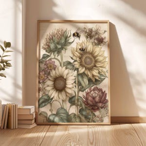 Puede incluir: Un estampado bot&aacute;nico enmarcado con girasoles, otras flores y abejas. La obra de arte tiene una est&eacute;tica vintage con colores suaves, incluyendo crema, amarillo y verdes apagados. El marco de madera complementa el tema natural de la obra.