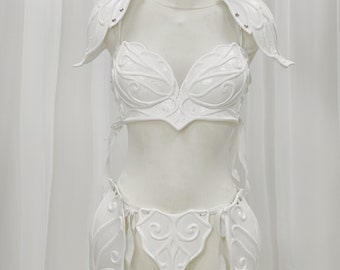 May include: White, ornate, plastic, costume armor for the chest and hips. The armor has a sculpted, floral design.