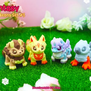 May include: Set of four fantasy-themed Mini Beans figurines. The figurines are in various colors, including tan, yellow, blue, and gray, with orange and brown accents. The text "Fantasy Mini Beans Set #3" is visible.