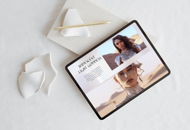 May include: A digital tablet displaying a webpage with the text "Iridescent Light Goddess" and images of a woman in desert scenery. A gold pen rests on a white ceramic shape, with additional white ceramic pieces nearby.