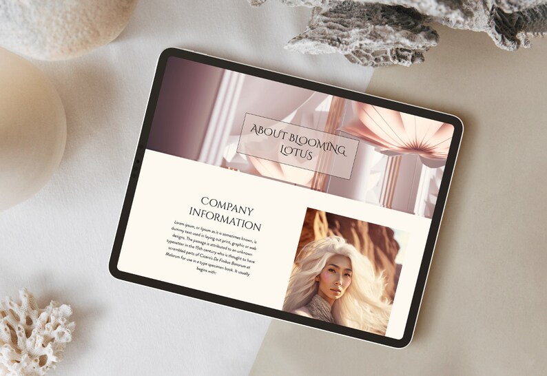 May include: A tablet displaying a website with the text "About Blooming Lotus" and "Company Information." The website features a photo of a woman with long white hair and a pink floral design. The tablet is on a neutral-toned surface.