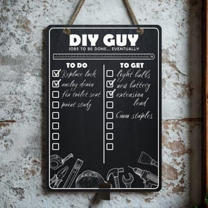 May include: Black chalkboard sign with the text "DIY GUY" and a to-do list. The list includes tasks like "Replace lock" and "Unclog drain." The sign is hanging on a textured wall with a rope.