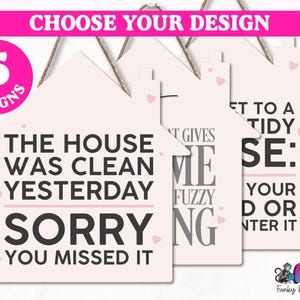 May include: Five different designs for a pink house-shaped sign with a white background. The signs feature humorous sayings about a clean house. The first sign reads "The house was clean yesterday. Sorry you missed it." The second sign reads "What gives me fuzzy feeling." The third sign reads "Get to a tidy house: Your  job or enter it."